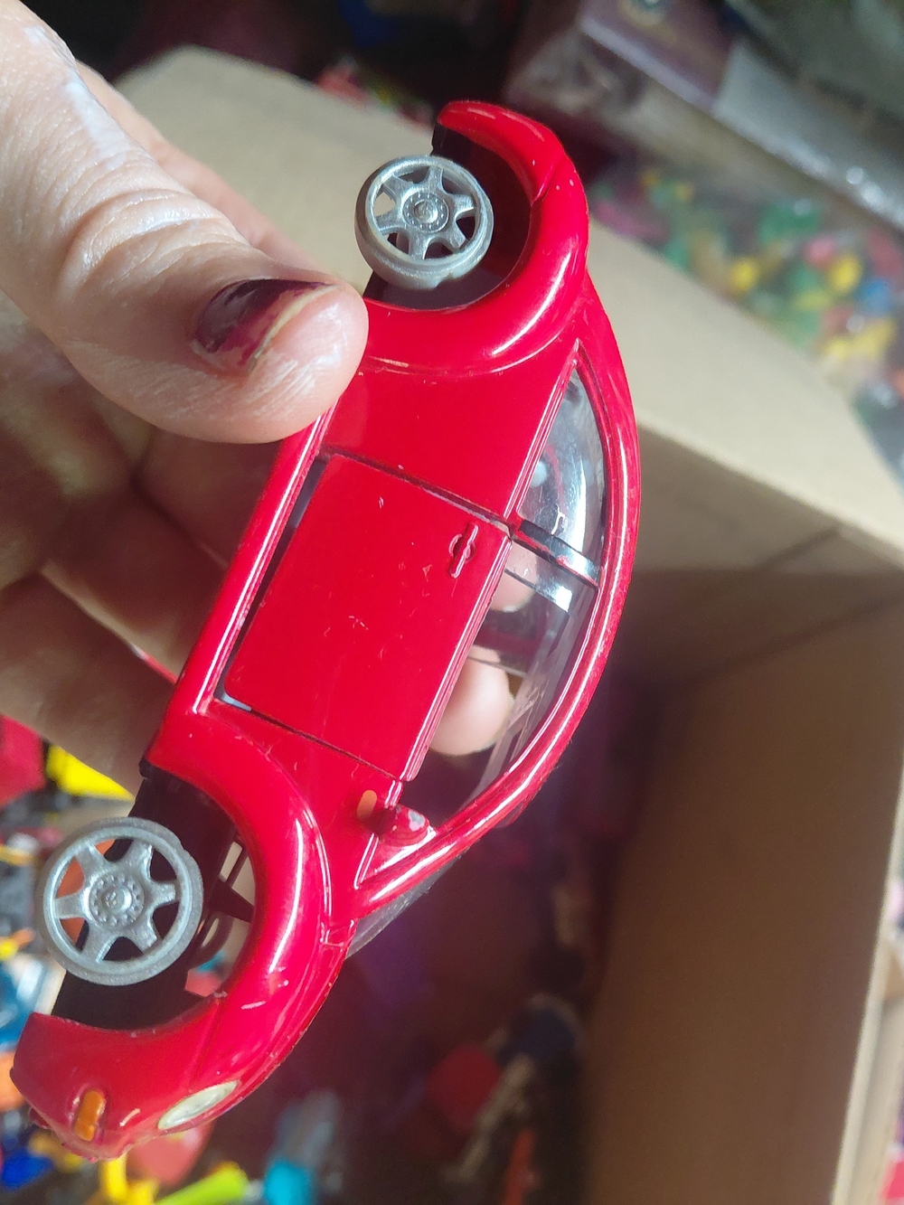 red Boley 1/32 scale Volkswagen New Beetle die-cast toy car. missing tires